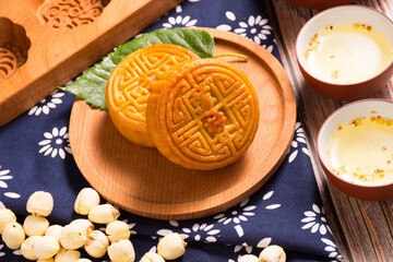 Fototapeta premium Traditional Chinese mooncakes with lotus seeds and tea
