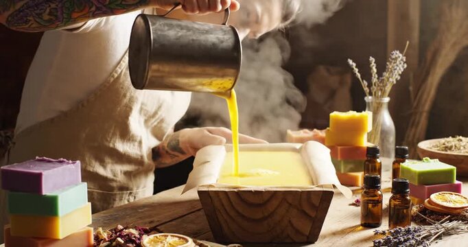Man pouring soap mixture into mold.