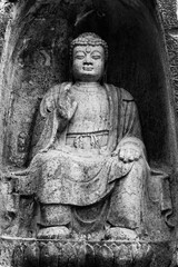 Obraz premium Ancient Buddha Stone Carving at Feilai Peak in Hangzhou