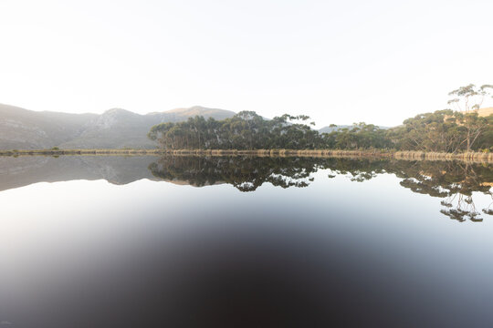 placid pond at sunset, overlooking Klein Mountains, Stanford, South Africa