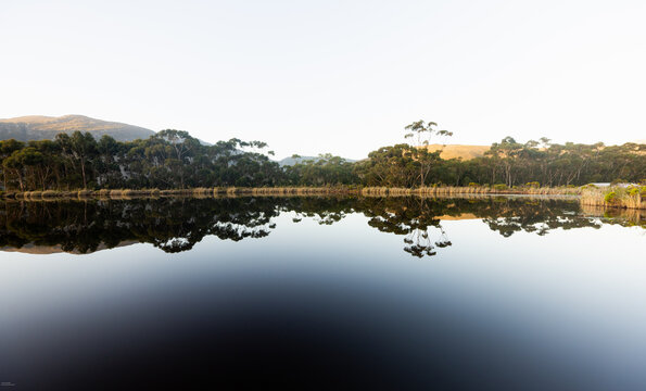 placid pond at sunset, overlooking Klein Mountains, Stanford, South Africa