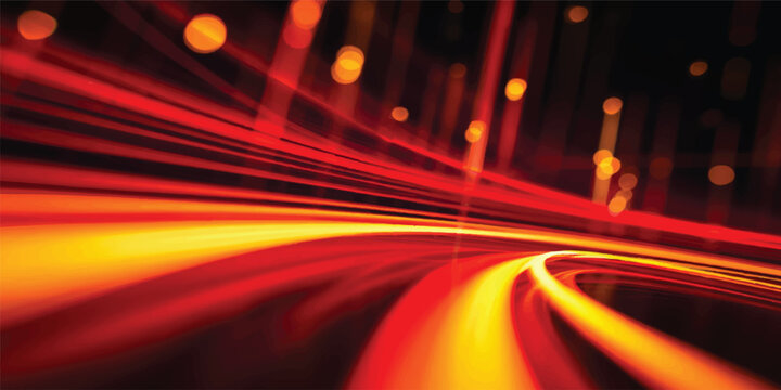 An abstract night background of fast blurred cars and red traffic lights in motion on a busy city highway street