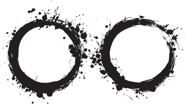 Two black ink circles with splatters white