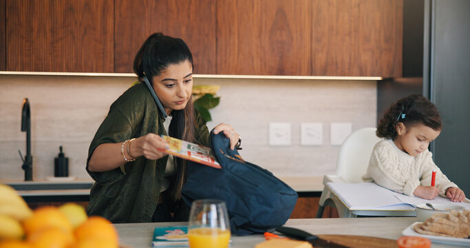 Daughter, packing bag and phone call with mother in kitchen for multitasking or preparation. Busy, getting ready and textbook of girl child with single parent in apartment for kindergarten education