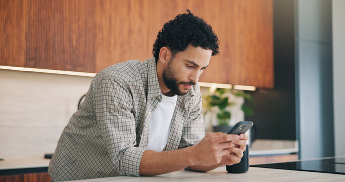 Phone, online and man in kitchen for reading message, blog or browsing social media in home. Mobile, review and person in house for internet connection, texting and check forum with website post