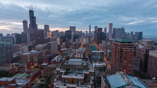 Stunning chicago cityscape transforming from sunset to night a dynamic motion timelapse showcasing urban transition and illuminated buildings.