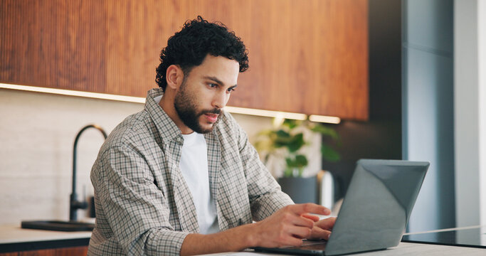 Remote work, review or man in kitchen with laptop, proofreading or novel editing in home. Reading, wfh or author in house with tech, typing manuscript or chapter planning in story development.
