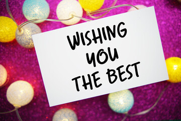 Obraz premium Wishing You The Best text written on paper card with LED cotton balls decoration
