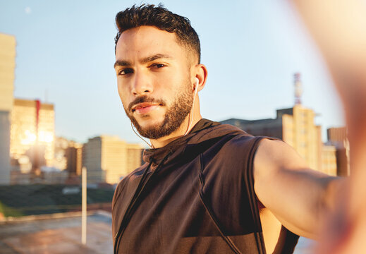 Portrait, athlete and man with selfie outdoor for photography, social media and fitness post. Pov, male person and runner with earphones, profile picture update and capture memory for vlogging sports
