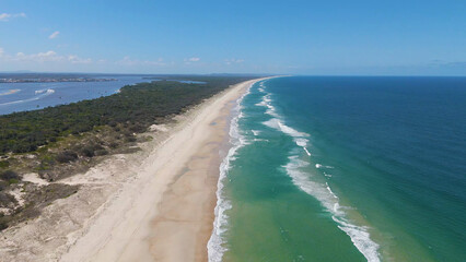 Aerial View of South Stradbroke Island Beach and Turquoise Ocean Waves © blueringmedia