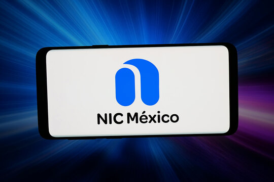 Stuttgart, Germany - 05-13-2026: In this photo illustration, the logo of Internet services organisation NIC Mexico is displayed on a smartphone in front of abstract background on computer screen.