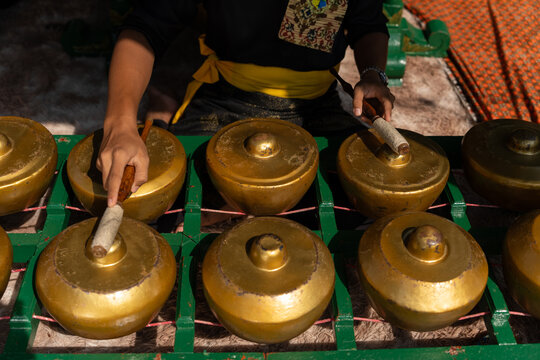 Musician Playing Traditional Gamelan Instrument