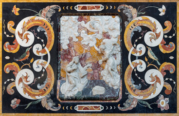 Fototapeta premium CREMA, ITALY - MARCH 20, 2026: The stone baroque relief of Annunciation in the church Chiesa della Santissima Trinita by unknown artist of 18. cent. 