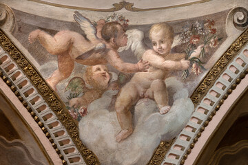 Fototapeta premium CREMA, ITALY - MARCH 20, 2026: The fresco of angels with the flowers the church Santuario di Santa Maria della Croce by Giacomo Parravicino - il Gianolo (1702).