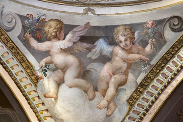 Fototapeta premium CREMA, ITALY - MARCH 20, 2026: The fresco of angels with the flowers the church Santuario di Santa Maria della Croce by Giacomo Parravicino - il Gianolo (1702).