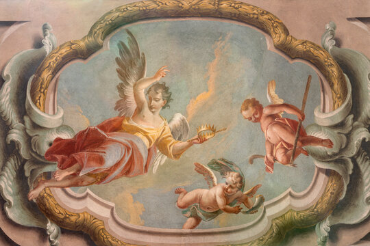 CREMA, ITALY - MARCH 20, 2026: The fresco of baroque angels with the symbols of David the church Santuario di Santa Maria della Croce by brothers Giuseppe and Giovanni Antonio Torricell from year 1762