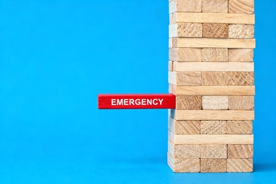 Wooden block tower with emergency sign