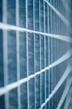 Abstract lines of industrial metal fence
