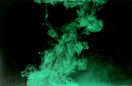 Abstract green or light green watercolor spread or stain on black background,Color Abstract,Green fluorescent