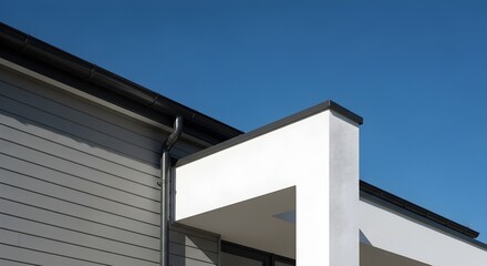 Fototapeta premium Modern Architectural Home With Clean Lines Against Blue Sky