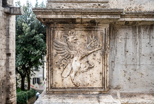 Griffin bas-relief on the angular pilaster of the Church of Madonna della Luce, in via dei Priori, Perugia historical center, Umbria region, Italy