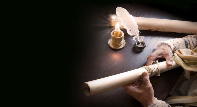 Man holding an old scroll