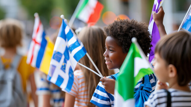 Rear view of diverse children waving flags of different countries with smiles, international children's day concept, flag waving diversity photography, cultural pride, defocused