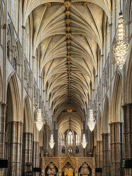 Gothic Westminster Abby Interior With Soaring Vaulted Ceiling, Arched Nave, Chandeliers and Ornate Altar Screen