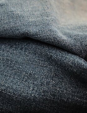 Blue denim fabric texture with soft folds
