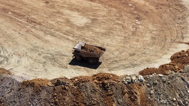 Aerial close up of dump truck in mining pit Utah high desert