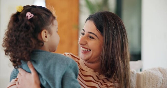 Kiss, cheek and mom with child in home with affection, bonding and loving relationship together. Family, happy and mother with girl embrace for connection, love and trust for parenting in living room