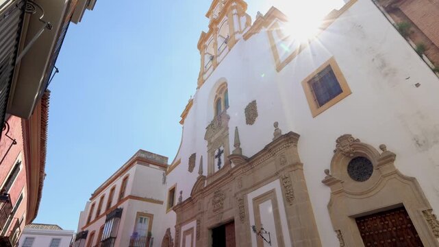Smooth upward pan of historic church tower in Seville Andalusia