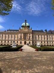 Fototapeta premium Straka Academy in Prague is a striking neo-baroque government building on the Vltava River in Malá Strana, serving as the Czech government seat since 1993 with gardens open seasonally visitors