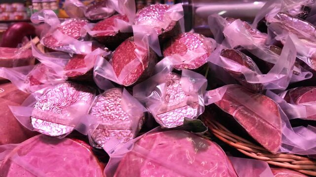 Assortment of Packaged Cured Meats in a Supermarket Display