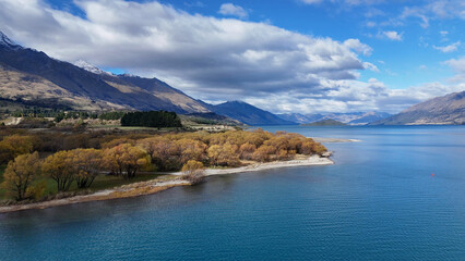 Fototapeta premium Aerial View of Glenorchy Lake with Autumn Trees and Mountains