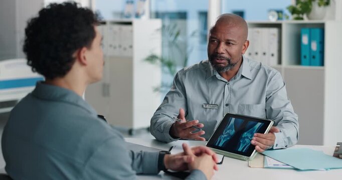Doctor, patient and x ray with tablet screen, conversation and diagnosis for bone fracture in office. Healthcare worker, people and talk with tech, radiology scan and medical test results for injury