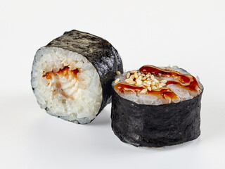 Unagi maki sushi rolls with teriyaki sauce and sesame seeds isolated on white background © Andrei Starostin