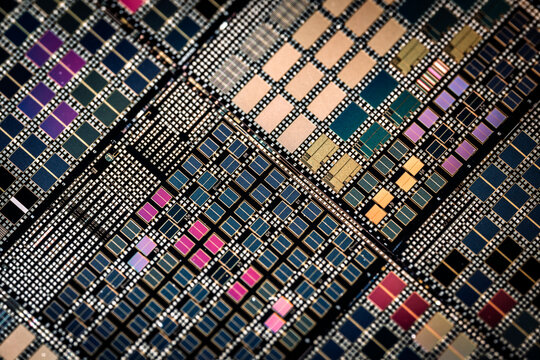 Silicon semiconductor wafer with integrated circuit die mosaic pattern.