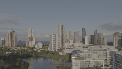 Fototapeta premium Aerial View of Gold Coast Skyscrapers and Waterway at Sunset
