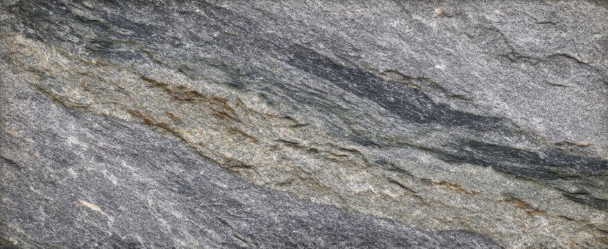 Natural stone surface resembles a rugged mountain range with cool gray veins and textures.