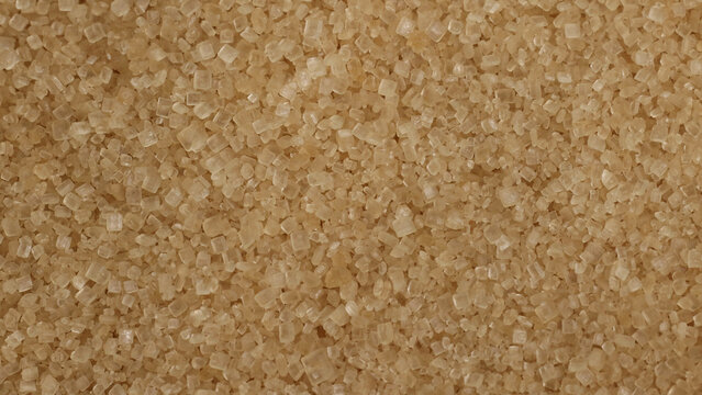 Macro Close-Up of Raw Brown Sugar Granules and Crystalline Texture