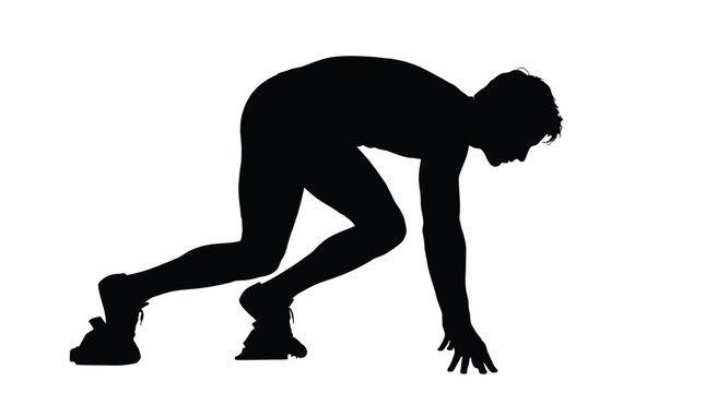 Athletic runner in a crouched starting position ready to sprint forward during a competitive track race as captured in this high contrast silhouette photo focusing on speed and intense human power