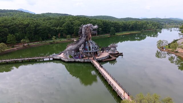 Cinematic FPV drone flight around iconic dragon water park in Hue, Vietnam. Famous abandoned landmark and popular travel attraction in central Vietnam, Southeast Asia.