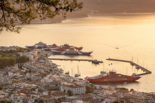 Thasos Town Waterfront with Red Ferry and Mountain Background