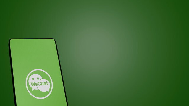 New Delhi, India - May 16 2026: WeChat logo on a green smartphone screen with a soft green background, communication and messaging app concept
