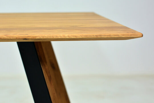Wooden tabletop with minimalist metal leg