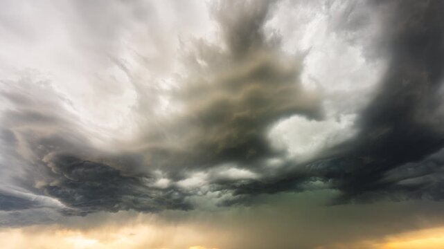 Massive storm clouds flowing across the sky in severe weather time lapse