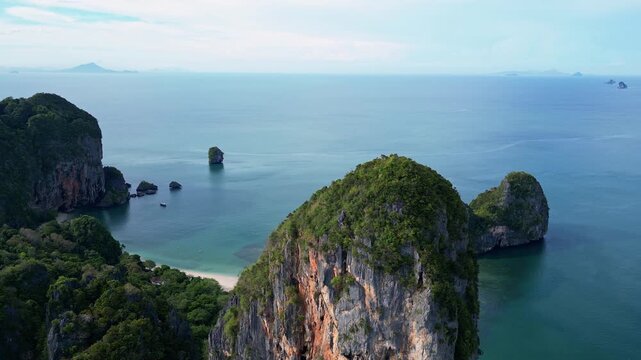 Krabi, Thailand : Aerial drone footage from limestone cliff revealing the famous white sand Phra Nang Beach in Railay in Andaman sea coastline near Krabi, Thailand