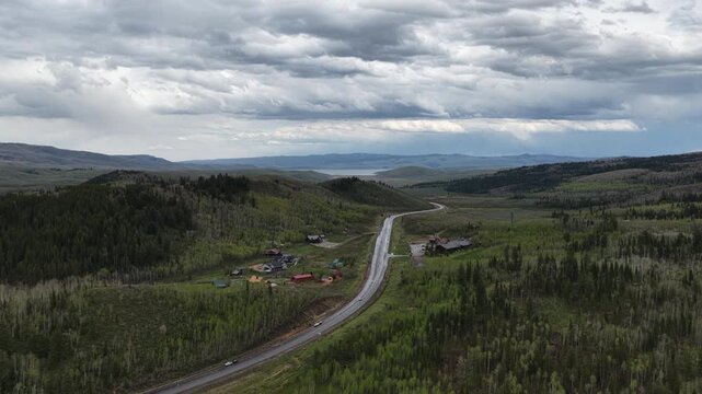 Aerial of Daniels Pass on US highway 40 in rain storm in Uinta Mountains in Utah in spring