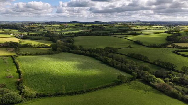 West Country farmland with late sun and fast moving clouds